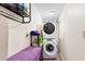 Convenient laundry room features stacked washer and dryer at 565 Lake Mystic Ln, Lakeland, FL 33813