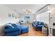 Relaxing living room with blue sofas and wood floors at 565 Lake Mystic Ln, Lakeland, FL 33813
