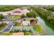 Aerial view showing the pool, tennis courts, picnic pavilion and waterfront of this community at 565 Lake Mystic Ln, Lakeland, FL 33813