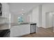 Bright kitchen boasts white cabinets, stainless steel appliances, and granite countertops, offering a modern and clean design at 5251 Sw 164Th Street Rd, Ocala, FL 34473