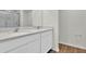 Bright bathroom features a double vanity with modern fixtures and a glass-enclosed shower at 418 Marion Oaks Ln, Ocala, FL 34473