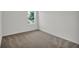 Comfortable carpeted bedroom featuring natural light and a tranquil atmosphere, creating a perfect retreat for relaxation at 418 Marion Oaks Ln, Ocala, FL 34473