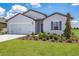 Beautiful single-Gathering home with a manicured lawn, a two-car garage, and tasteful landscaping at 418 Marion Oaks Ln, Ocala, FL 34473