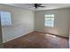 Bedroom with two windows and wall-to-wall carpeting at 1814 Lowry Ave, Lakeland, FL 33801