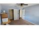 Shows a bedroom with blue walls and carpeted flooring at 1814 Lowry Ave, Lakeland, FL 33801