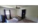 A bedroom with natural lighting and carpeted floors at 1814 Lowry Ave, Lakeland, FL 33801