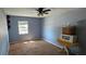 A secondary bedroom with a ceiling fan and overhead lighting at 1814 Lowry Ave, Lakeland, FL 33801