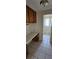 Shows a hallway desk leading to a bathroom with natural light at 1814 Lowry Ave, Lakeland, FL 33801