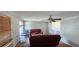 A cozy living room featuring neutral walls and a ceiling fan at 1814 Lowry Ave, Lakeland, FL 33801