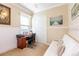 Functional bedroom with a desk, futon, and a window for natural light at 8339 Bridgeport Bay Cir, Mount Dora, FL 32757