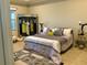Stylish bedroom with a queen bed and unique artwork at 8339 Bridgeport Bay Cir, Mount Dora, FL 32757