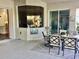Covered patio with dining set perfect for outdoor meals at 8339 Bridgeport Bay Cir, Mount Dora, FL 32757