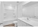 Bathroom features a tub-shower combo and a modern, white vanity with countertop sink at 14192 Sw 44Th Ct, Ocala, FL 34473