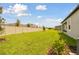 Backyard view of homes with grassy lawn at 4837 Foxglove Cir, Lakeland, FL 33811