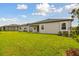 Houses with grassy backyards and vinyl fence at 4837 Foxglove Cir, Lakeland, FL 33811