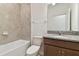 Clean bathroom, granite vanity, and tile shower/tub combo at 4837 Foxglove Cir, Lakeland, FL 33811