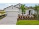 Attractive one-story home with a two-car garage and landscaped front yard at 4837 Foxglove Cir, Lakeland, FL 33811