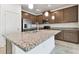 Modern kitchen with stainless steel appliances and granite countertops at 4837 Foxglove Cir, Lakeland, FL 33811