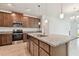 Island kitchen with stainless steel appliances and granite countertops at 4837 Foxglove Cir, Lakeland, FL 33811