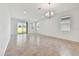 Bright living room with sliding glass doors leading to backyard at 4837 Foxglove Cir, Lakeland, FL 33811