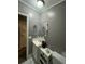 Simple bathroom featuring a sink, toilet, and mirror at 4316 Upper Meadow Rd, Mulberry, FL 33860