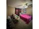 Bright bedroom with a double bed and crib at 4316 Upper Meadow Rd, Mulberry, FL 33860