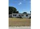 Single-wide manufactured home with a spacious yard at 4316 Upper Meadow Rd, Mulberry, FL 33860