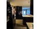 Kitchen features dark cabinetry, appliances, and an island at 4316 Upper Meadow Rd, Mulberry, FL 33860