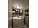 Laundry room with washer, dryer, and overhead shelving at 4316 Upper Meadow Rd, Mulberry, FL 33860