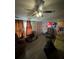 Cozy living room featuring a ceiling fan, comfortable seating, and a TV at 4316 Upper Meadow Rd, Mulberry, FL 33860