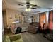 Living room with comfortable seating and a ceiling fan at 4316 Upper Meadow Rd, Mulberry, FL 33860