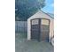 Outdoor storage shed with double doors and window accents at 4316 Upper Meadow Rd, Mulberry, FL 33860