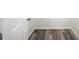 Close up on gray luxury vinyl plank flooring and a white door frame at 2700 Laguna Dr, Indian Lake Estates, FL 33855
