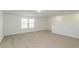 Spacious bonus room with neutral carpet and window at 4390 Sw 84Th Street Rd, Ocala, FL 34476