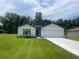 Charming single-story home featuring manicured lawn and a two-car garage in a quiet suburban neighborhood at 4270 Sw 143Rd Lane Rd, Ocala, FL 34473
