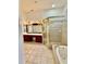 Primary bathroom boasts dual vanity, soaking tub, step-in shower and tile floors at 5446 Pebble Beach Dr, Lakeland, FL 33812