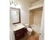Bathroom with vanity, toilet, and shower-tub combination at 5446 Pebble Beach Dr, Lakeland, FL 33812
