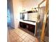 Bathroom with a large, framed mirror, double sinks, and a glass-enclosed shower at 5446 Pebble Beach Dr, Lakeland, FL 33812