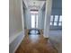 Inviting foyer with decorative tile, chandelier, and grand columns defining the entrance to the home at 5446 Pebble Beach Dr, Lakeland, FL 33812