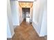 Long hallway featuring decorative insets and warm tile, creating an inviting passage through the home at 5446 Pebble Beach Dr, Lakeland, FL 33812