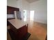 Kitchen with center island, dark cabinetry, and stainless steel appliances at 5446 Pebble Beach Dr, Lakeland, FL 33812
