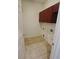 Laundry room with overhead cabinets, utility sink and tile flooring at 5446 Pebble Beach Dr, Lakeland, FL 33812