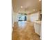 Spacious living room boasts tile flooring, recessed lighting, and sliding glass doors at 5446 Pebble Beach Dr, Lakeland, FL 33812