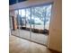 View of outdoor patio with fireplace, landscape, and lake at 5446 Pebble Beach Dr, Lakeland, FL 33812
