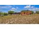 Expansive backyard view of a single story home with a screened in patio and spacious yard at 22134 Obrien Rd, Howey In The Hills, FL 34737