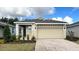 Charming single-story home features a two-car garage, neutral paint, and well-manicured landscaping at 4083 Nw 44Th Cir, Ocala, FL 34482