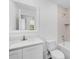 Bathroom featuring modern vanity, mirror, bath, and shower combination at 567 Bay Leaf Dr, Poinciana, FL 34759