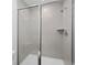 Modern bathroom with glass shower doors and tiled walls at 567 Bay Leaf Dr, Poinciana, FL 34759