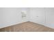 Bright bedroom with a window, carpet and a closet with bi-fold doors at 567 Bay Leaf Dr, Poinciana, FL 34759