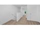 Upstairs hallway with natural light at 567 Bay Leaf Dr, Poinciana, FL 34759